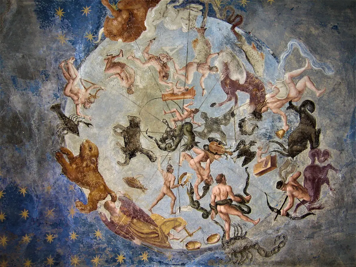 Affresco del cielo boreale con le costellazioni dello zodiaco su sfondo blu, a Palazzo Besta